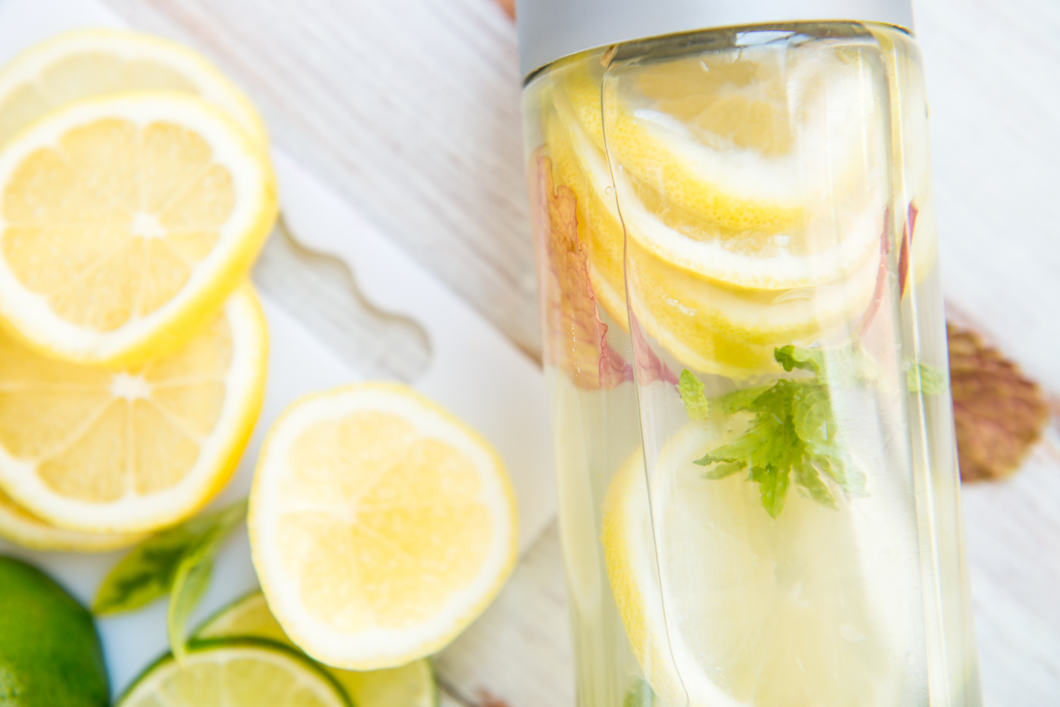 Glass bottle filled with lemon detox water 