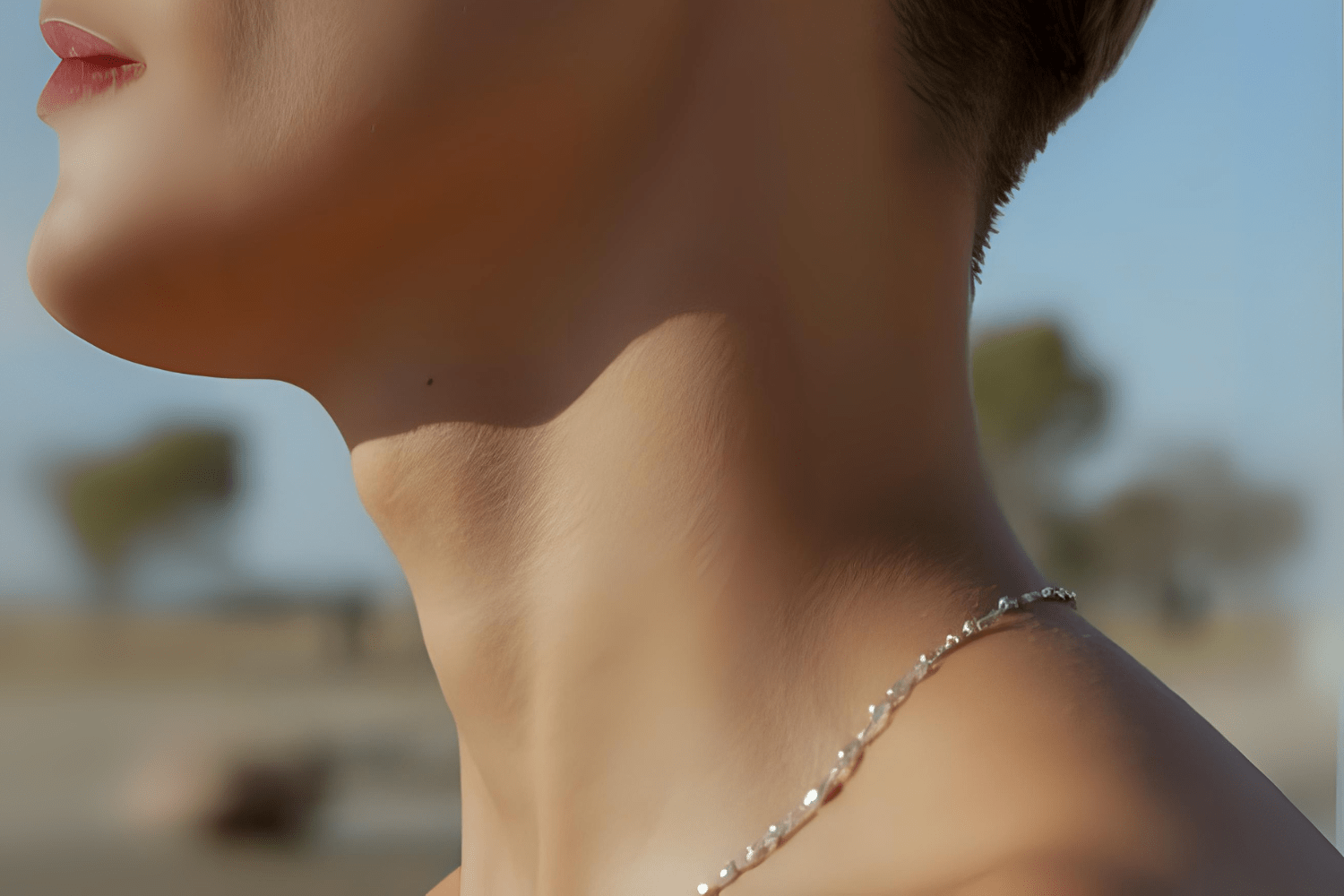 Close-up of woman’s neck showing thyroid area clearly